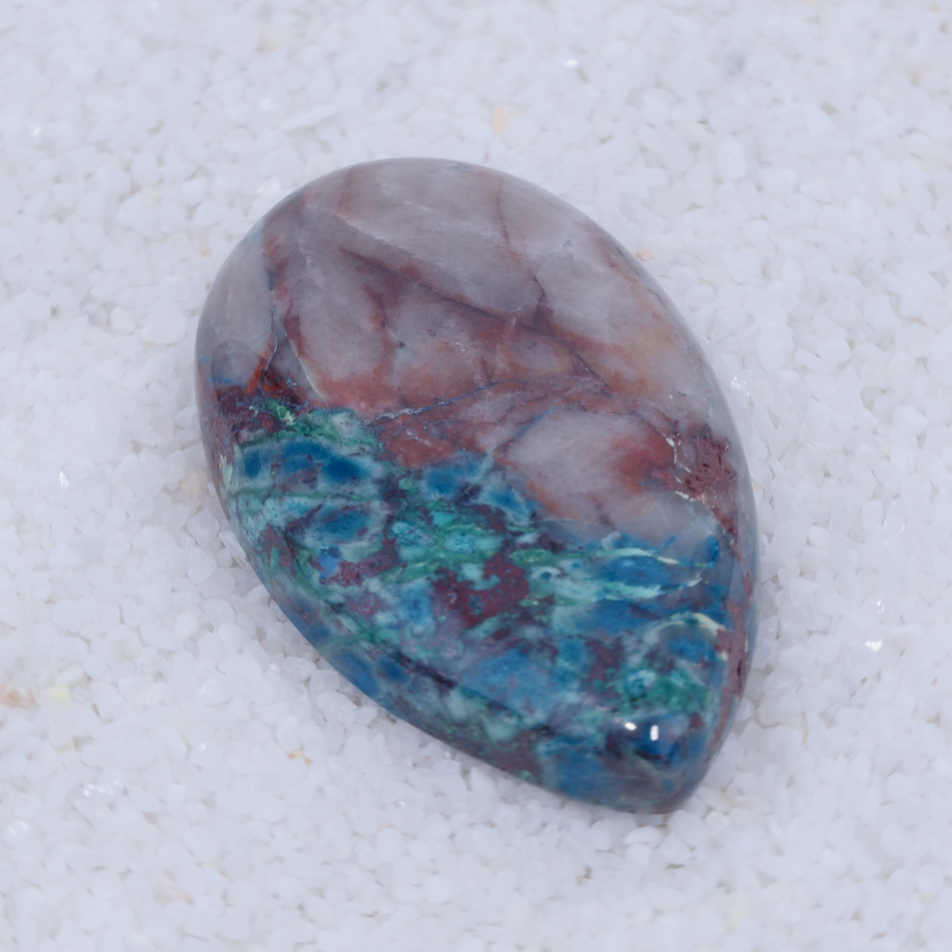 Multicolored Canyonite stone on a white background