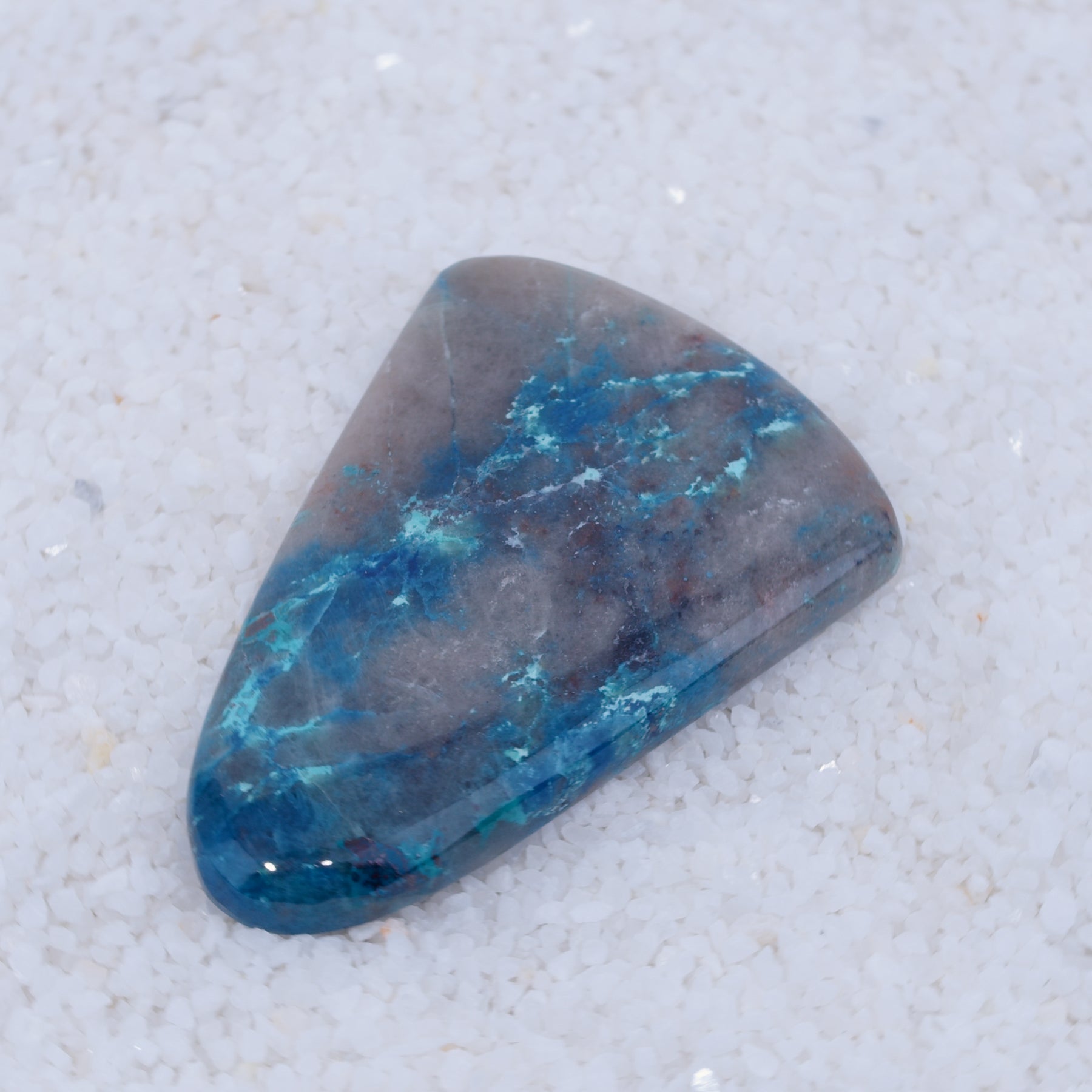 Dark blue Papagoite-bearing Canyonite cabochon cut from silica-hosted mineral material