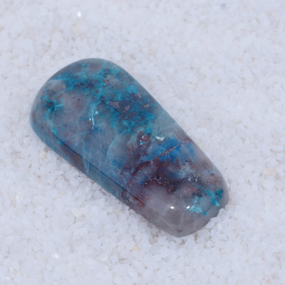 Blue and gray Canyonite stone on a white background