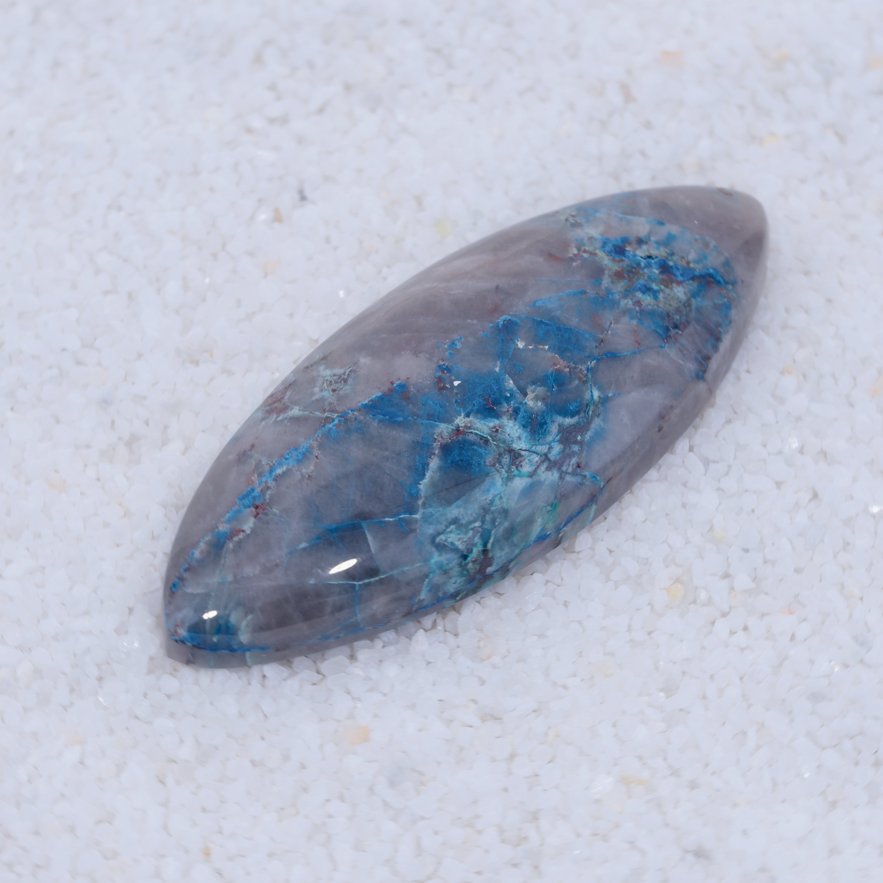 Blue and gray Canyonite stone on a white background