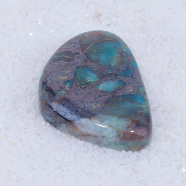 Multicolored Canyonite stone on a white background