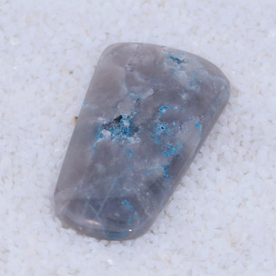 Gray Canyonite stone with blue veins on a white background