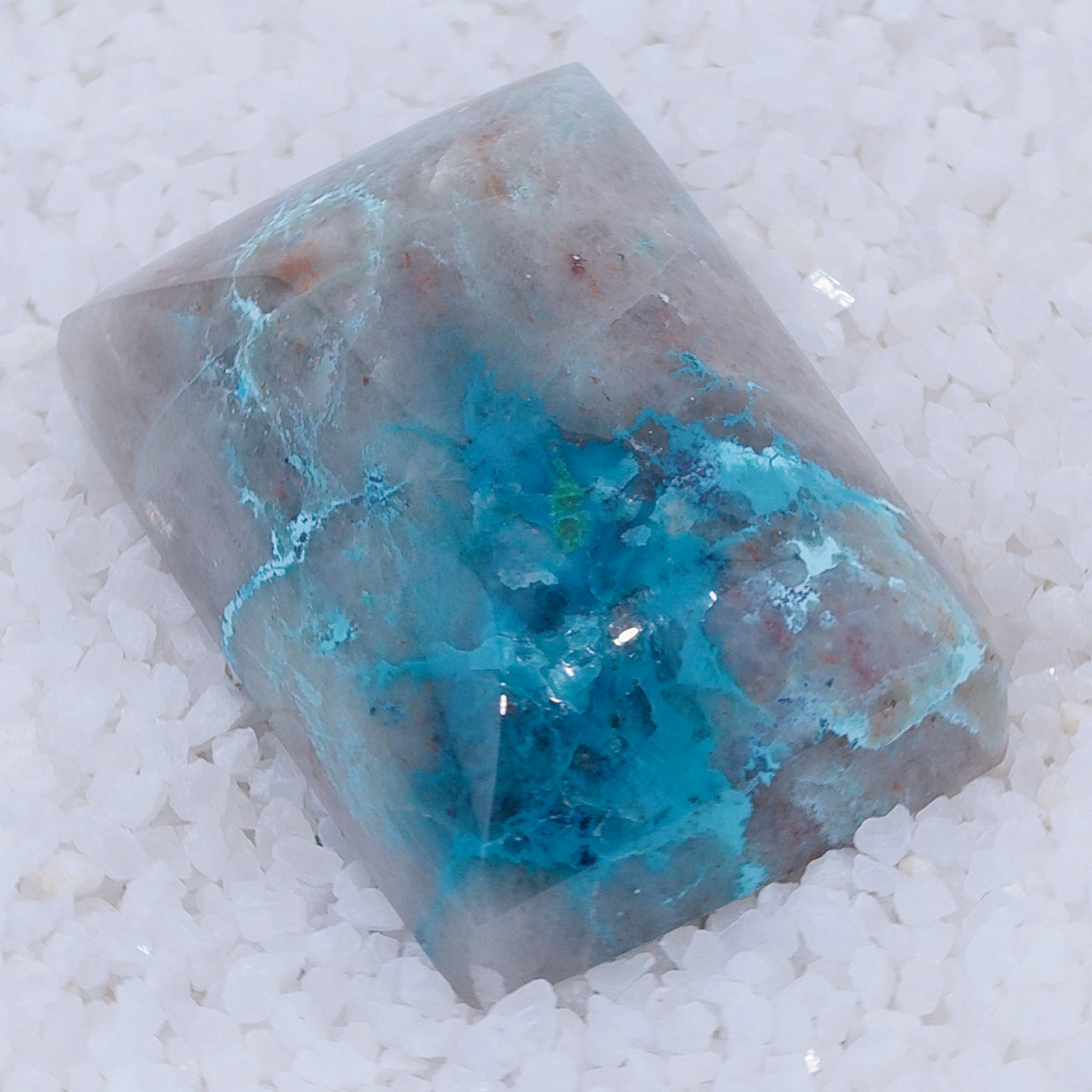 Crystal Canyonite with blue interior on a white background
